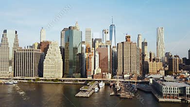 Aerial view of famous city New York, America, Manhattan business district. Drone flying low over the East river and pier