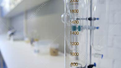 Close up of professional glass cylinder at chemistry lab