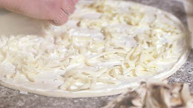 Chef hand making italian pizza at kitchen closeup. The process of cooking pizza. 4K
