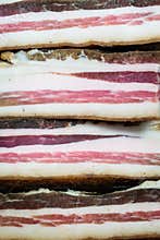 Pile of bacon. Smoked pork meat