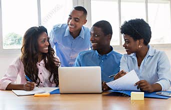 Laughing african american businessmen and businesswoman