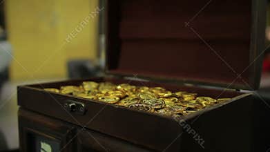 Female opening treasure chest, gold coins lying in wooden box, fortune