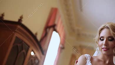 Bride and groom embracing in palace