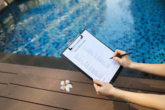 Close-up of woman fills out visa application form in UAE Dubai o