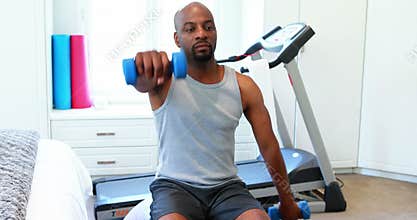 Man exercising with dumbbells 4k