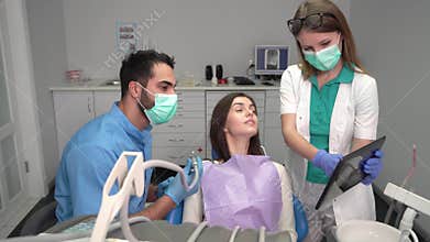 Dentist`s Assistant Brings Tablet