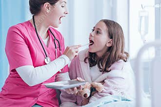 Nurse examining child