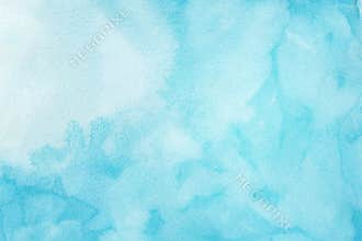 Abstract light blue watercolor background, painted on watercolor paper