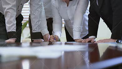 Managers gathered to exchange opinions on report, lady boss giving instructions