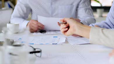 Business team with charts at office meeting