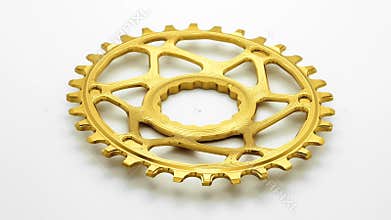 Golden oval bicycle chainring gear rotating