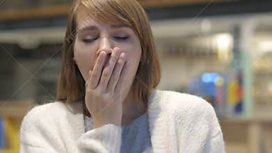 Tired Young Woman Yawning in Cafe, Indoor