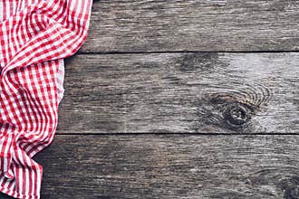 Kitchen plaid textile on old rustic wood. Food menu background