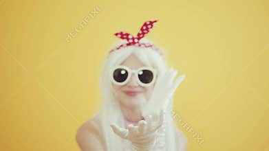 Blond girl with glasses in the image of anime doll