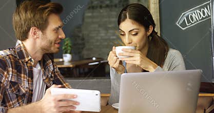 Couple discussing over digital tablet in cafe 4k