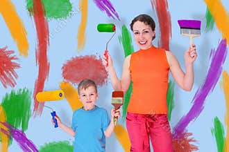 Son and mother draw with rollers and brushes