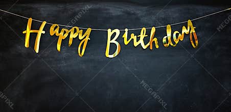 Happy birthday golden garland at a dark wall