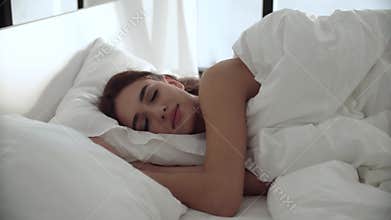 Sleep. Woman Sleeping In Bed With White Bedding At Light Bedroom