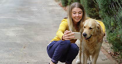 Young girl taking selfie with her dog 4k