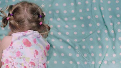 Childhood. Little Girl Lying And Laughing Closeup