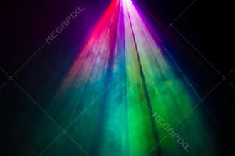 Beautiful rainbow color wide lens projector with light beam for movie and cinema at night . smoke texture spotlight , screening