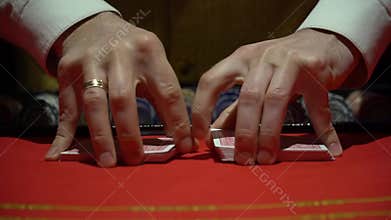 Casino, poker: Dealer shuffles the poker cards