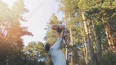 Loving dad playing with his daughter at home backyard