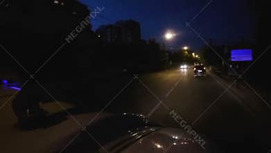 First aid vehicle overtaking cars in night driving on accident emergency call