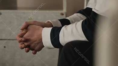 Car accident participant waiting for alcohol test police station, hands closeup