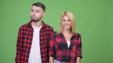 Young couple head nodding yes together