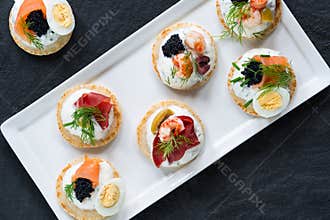 Selection of cocktail blinis - gourmet party food