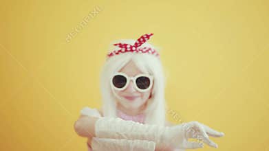 Blond girl with glasses in the image of anime doll