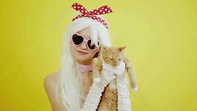 Blond girl with glasses in the image of anime doll