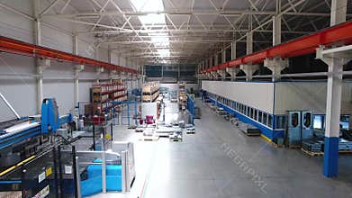 Inside the plant for the production of steel materials. Scene. Modern manufacturing storage with machine tools, roller