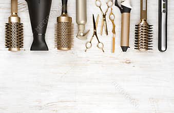Professional hair dresser tools on wooden background with copy space