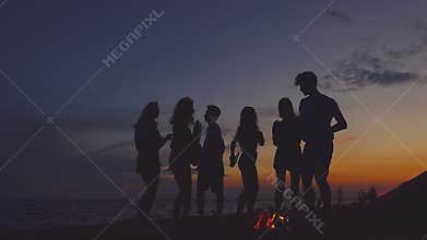 Beach party dancing. Slow-motion shooting.