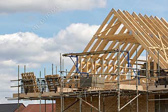Construction industry. Timber framework of house roof trusses wi