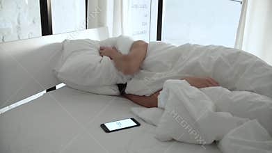 Alarm Clock On Phone. Woman Sleeping In Bed And Waking Up