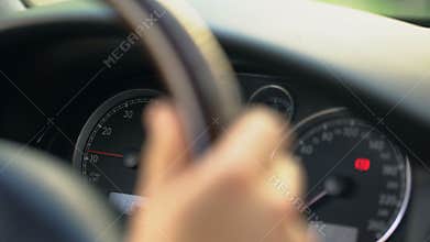 Close up of dashboard and male hand steering wheel, driver stuck in traffic jam