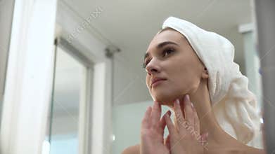 Beautiful Woman After Shower Looking In Mirror At Bathroom