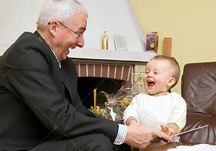 Grandfather playing with child