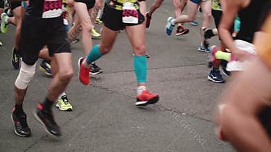 Saint Petersburg Russia, July 9 2017 - Legs and feet of professional runners in sport equipment at marathon slow motion.