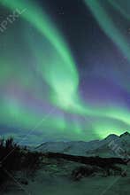 Northern lights over mountains