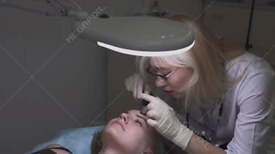 Beautiful young girl at the dermatologist
