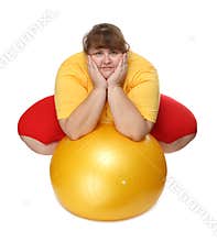 Overweight woman sitting with gym ball
