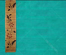 Flower bamboo banner on aquamarine wood