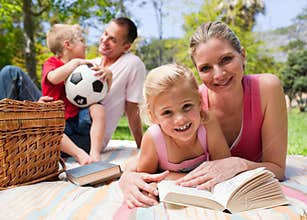 Happy young family enjoying a picnic