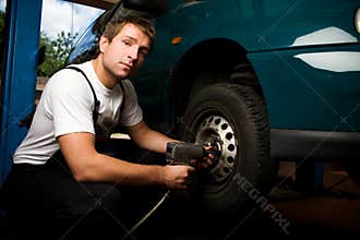 Mechanic fixing auto in car service