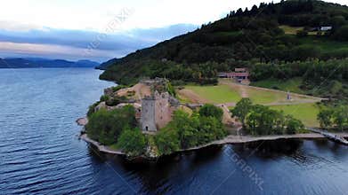 Loch Ness and Urquhart Castle in the evening - aerial drone footage