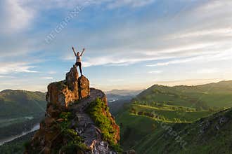 Happy woman on top mountain